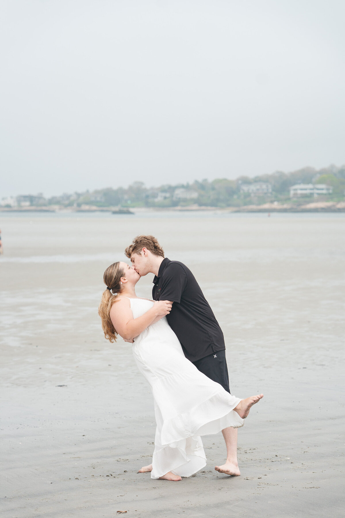 Romantic waterfront engagement session at Wingaersheek Beach in Massachusetts.