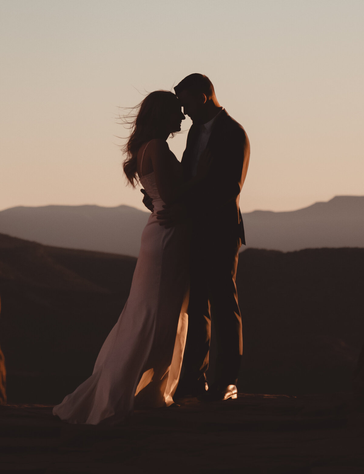 Couple looking out over Sedona red rocks Cathedral Rock taken by Kollar Photography