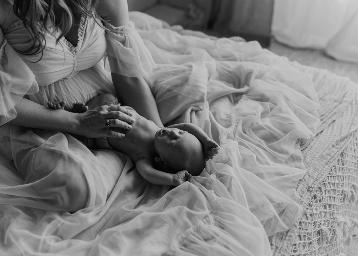 black and white fine art portrait of newborn during studio session in parker colorado