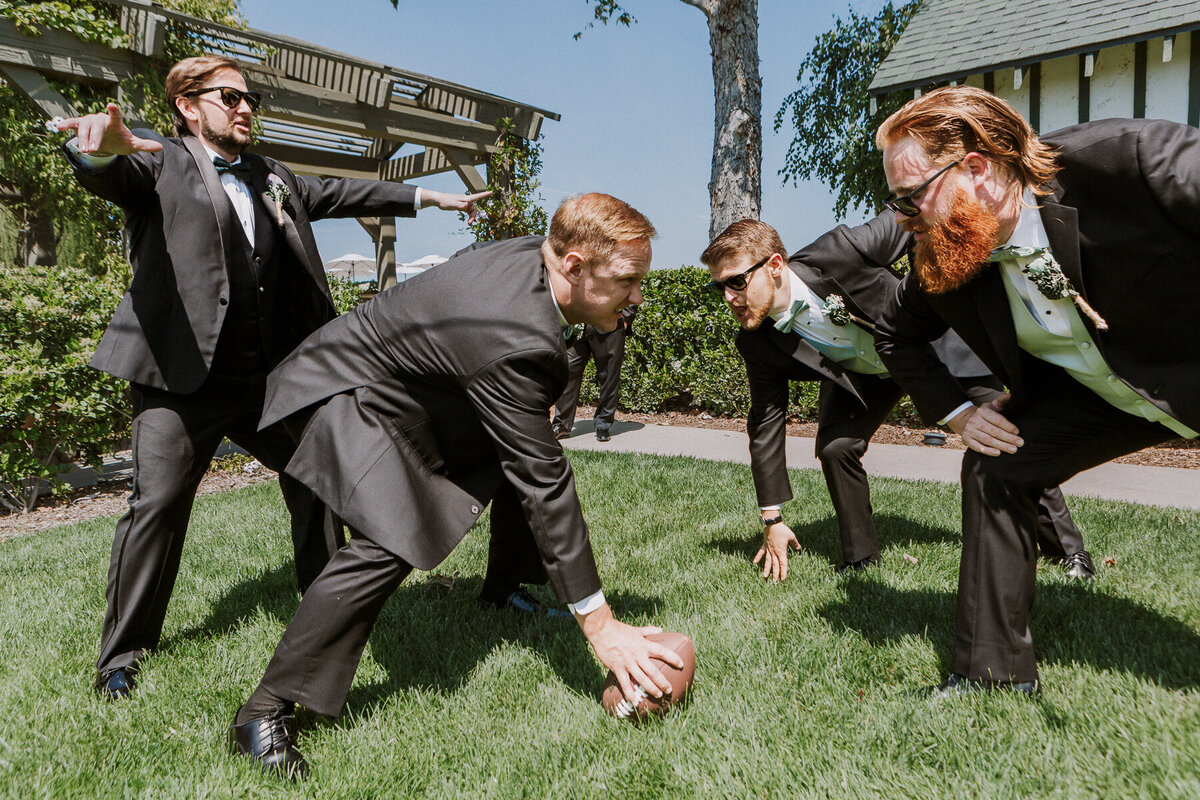 groomsmen playing football jewish ponte winery wedding temecula