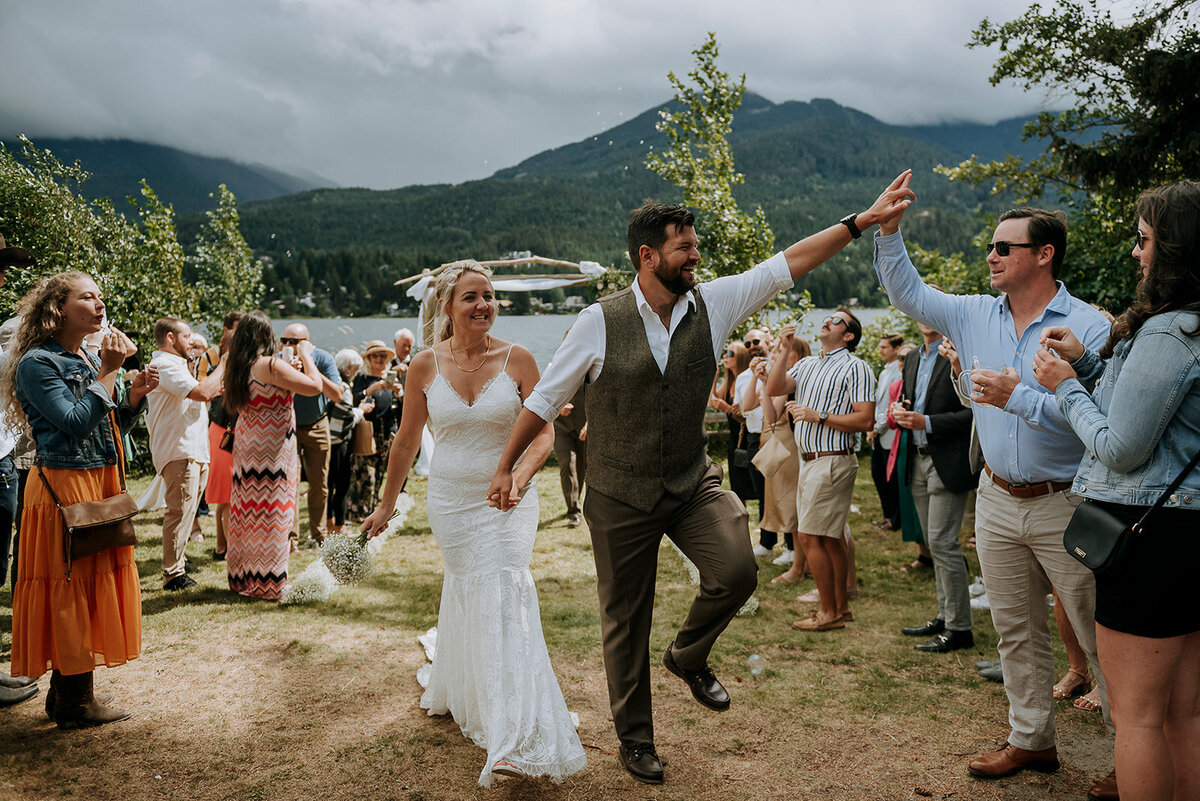 Couple high fives after Whistler wedding ceremony at Point Artist Run Center