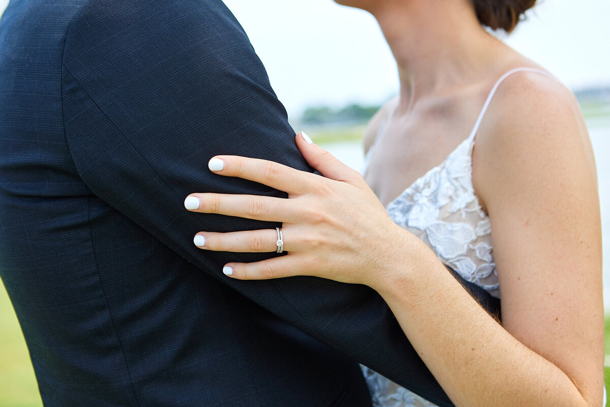 charleston-wedding-bride-and-groom-rings-hand