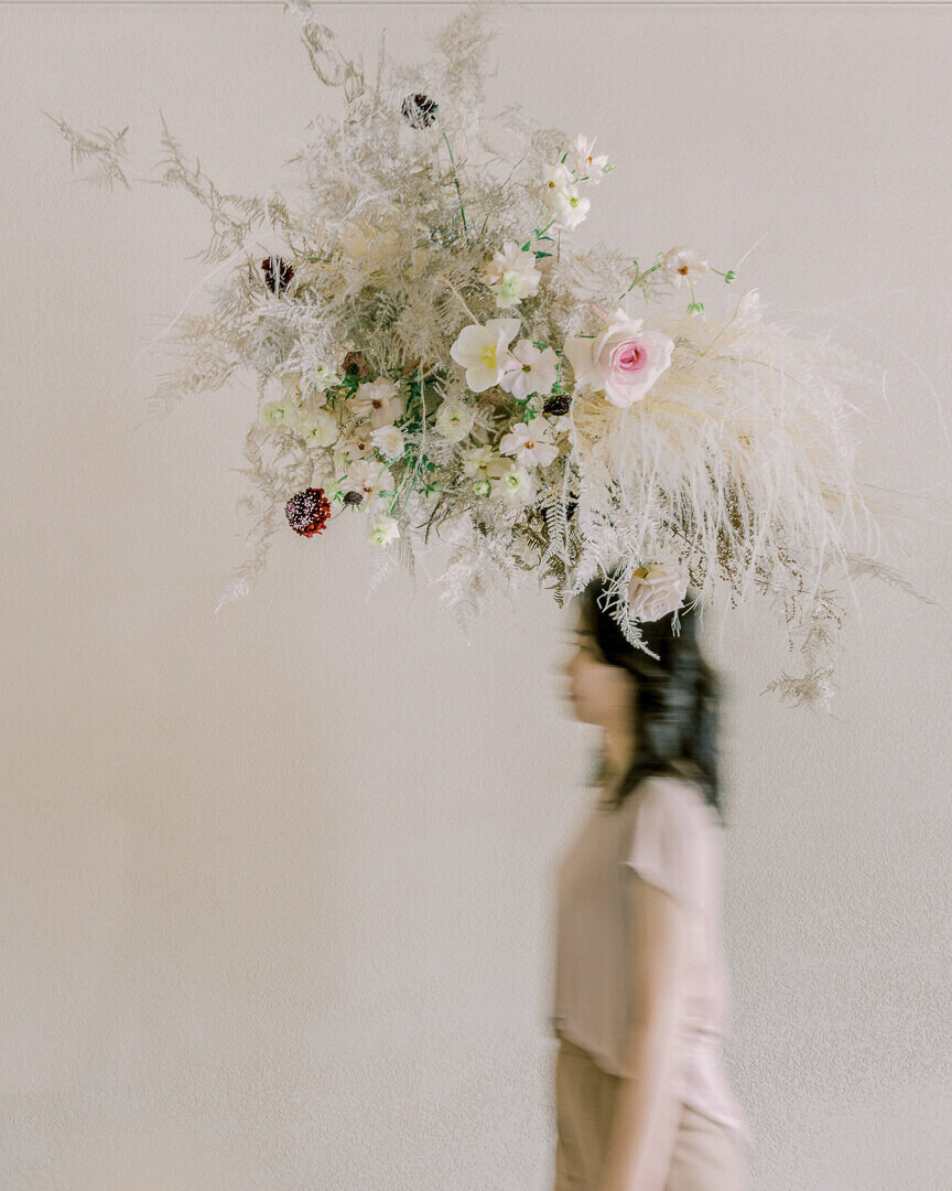 Naturally dried suspended floral installation in neutrals florist session