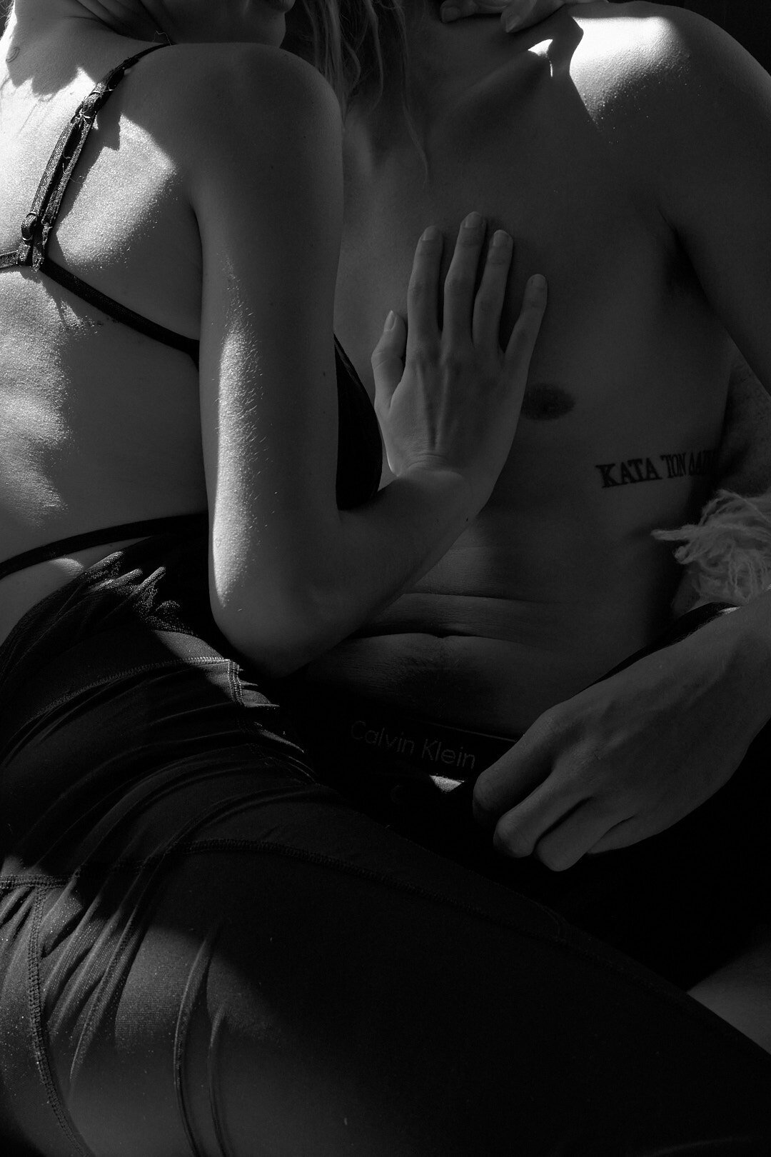She is touching his bare chest intimately