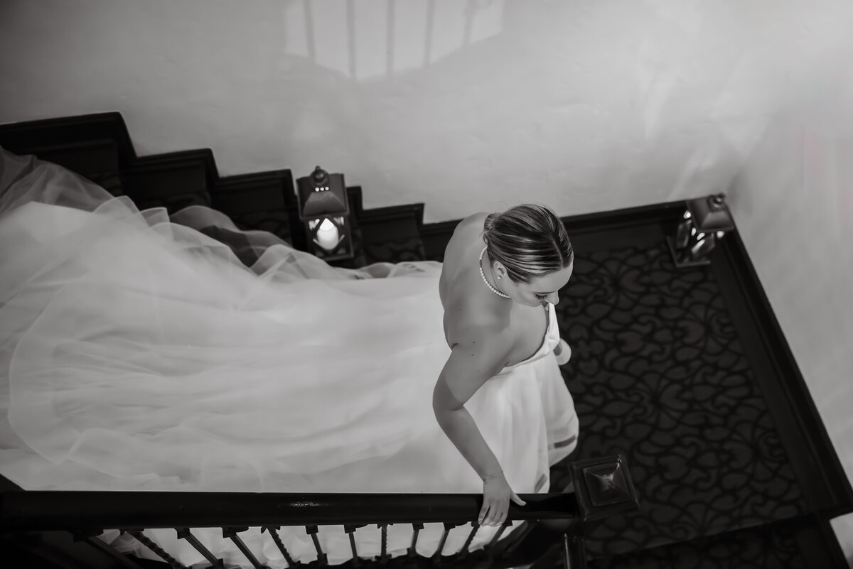 Bride elegantly walking down stairs