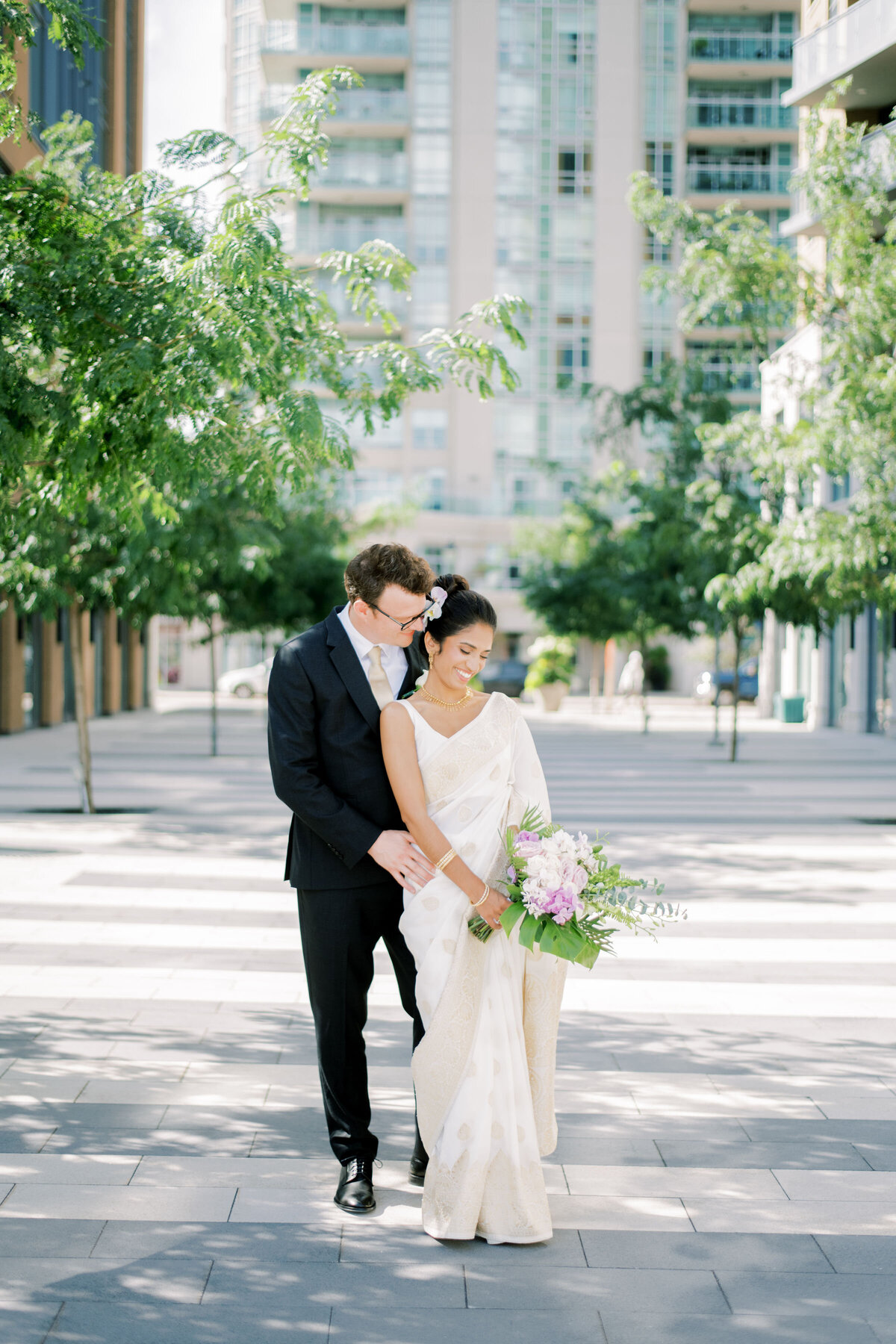 bride and groom sharing a moment together outside in the courtyard at the pearle hotel