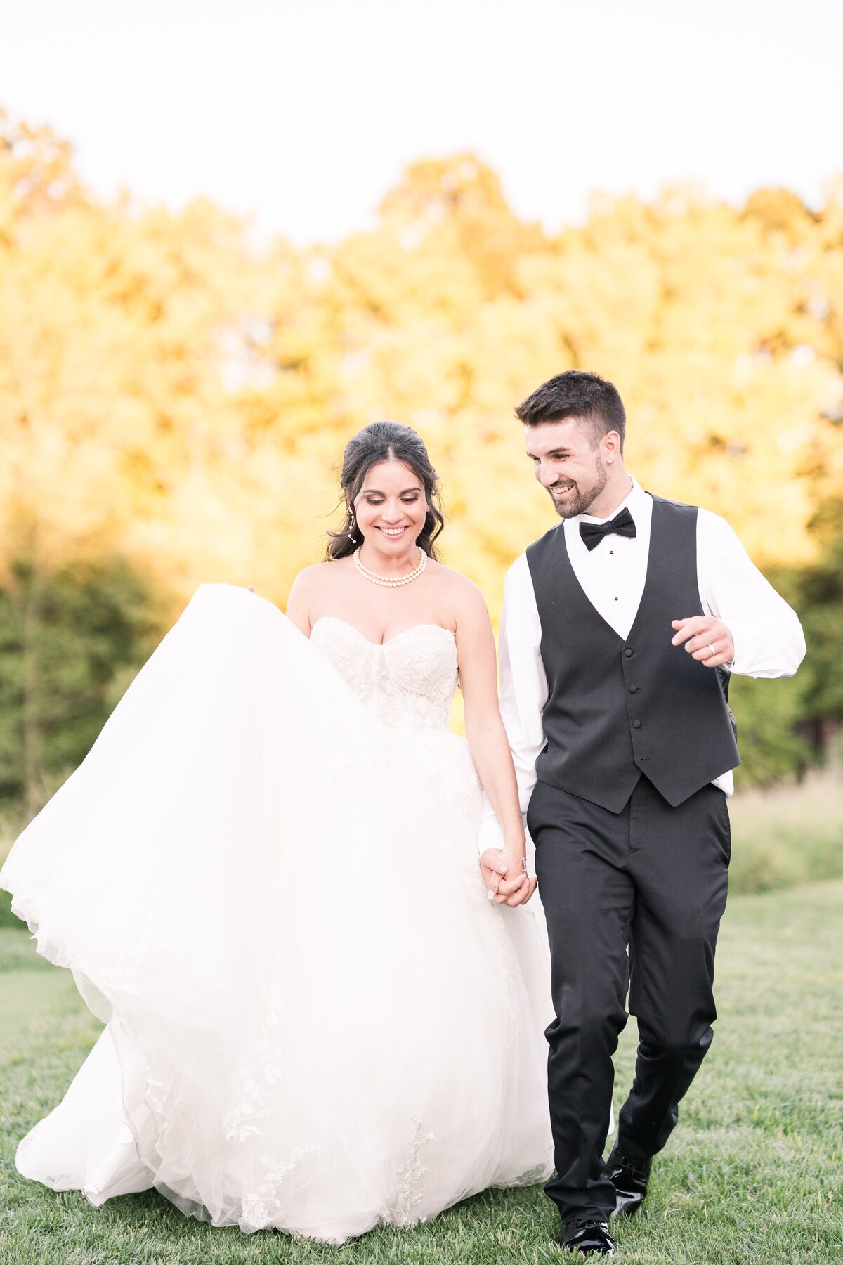couple holding hands and walking