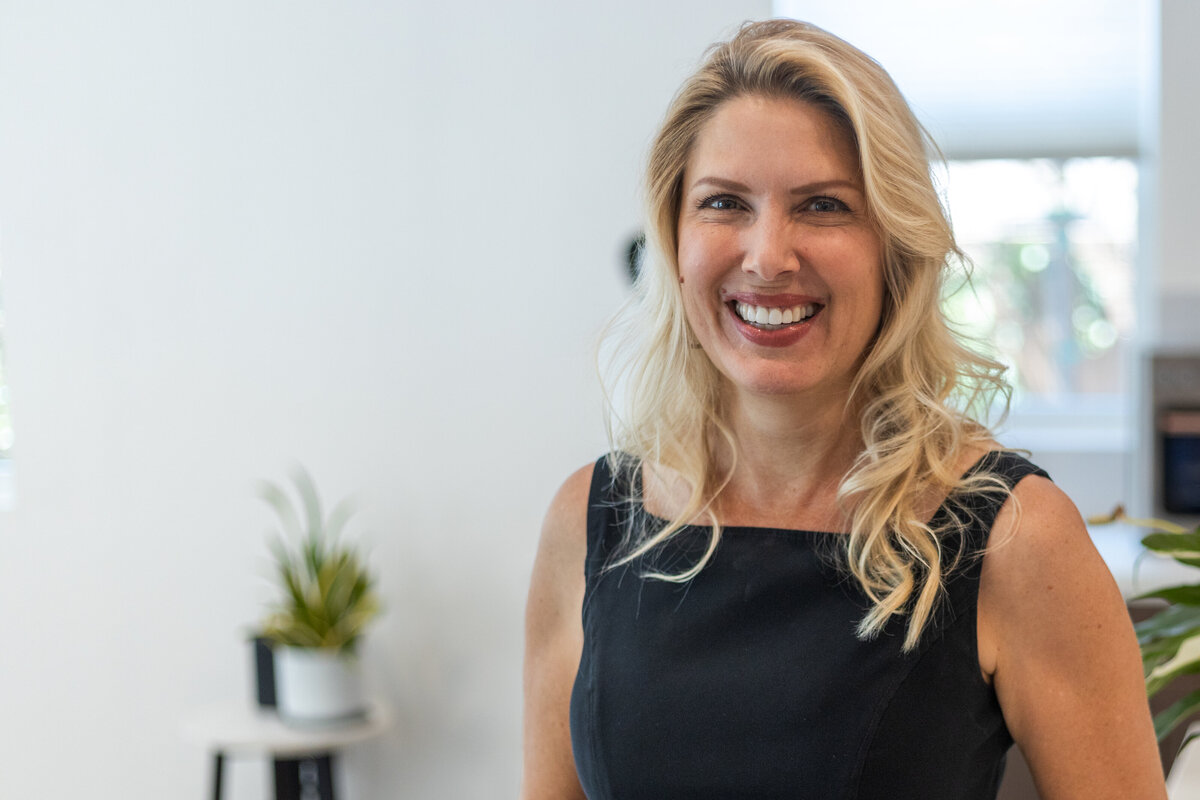 Headshot of Laura Bogart smiling at camera
