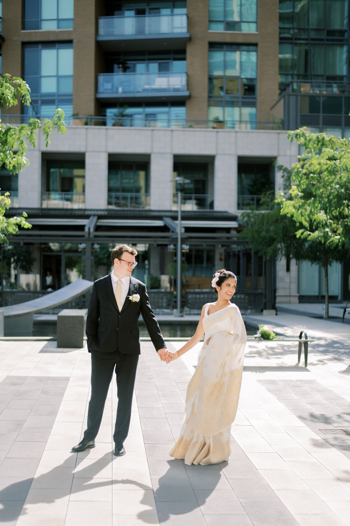 bride and groom sharing a moment together outside in the courtyard at the pearle hotel