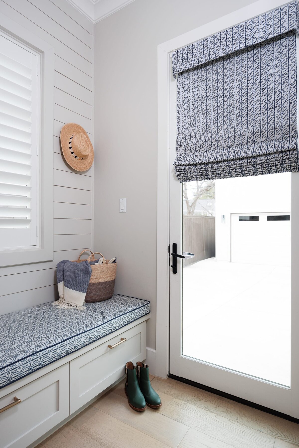 the keeping room interiors primera mudroom with bench and green rainboots