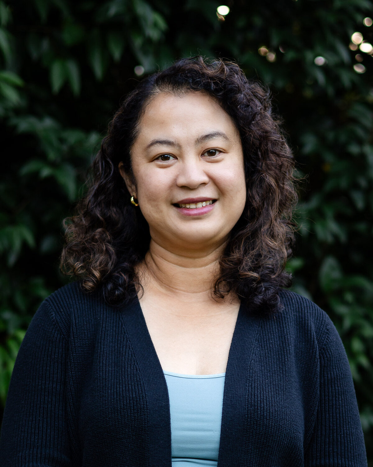 Authentic headshot of woman with curly hair in dark cardigan – Bay Area Headshot Portfolio – Ellobelle Photography