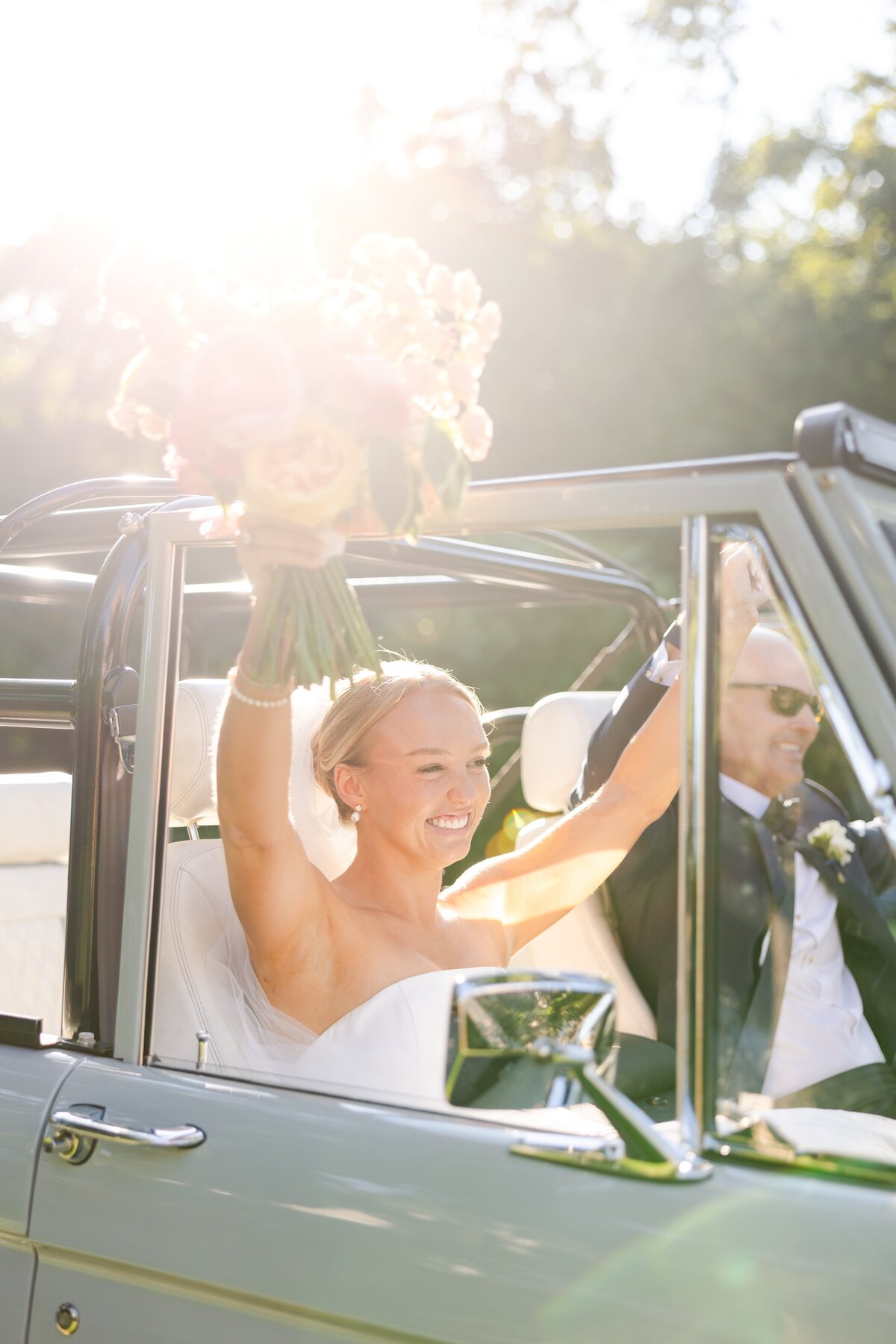 bride and father driving to ceremony in vintage green truck 