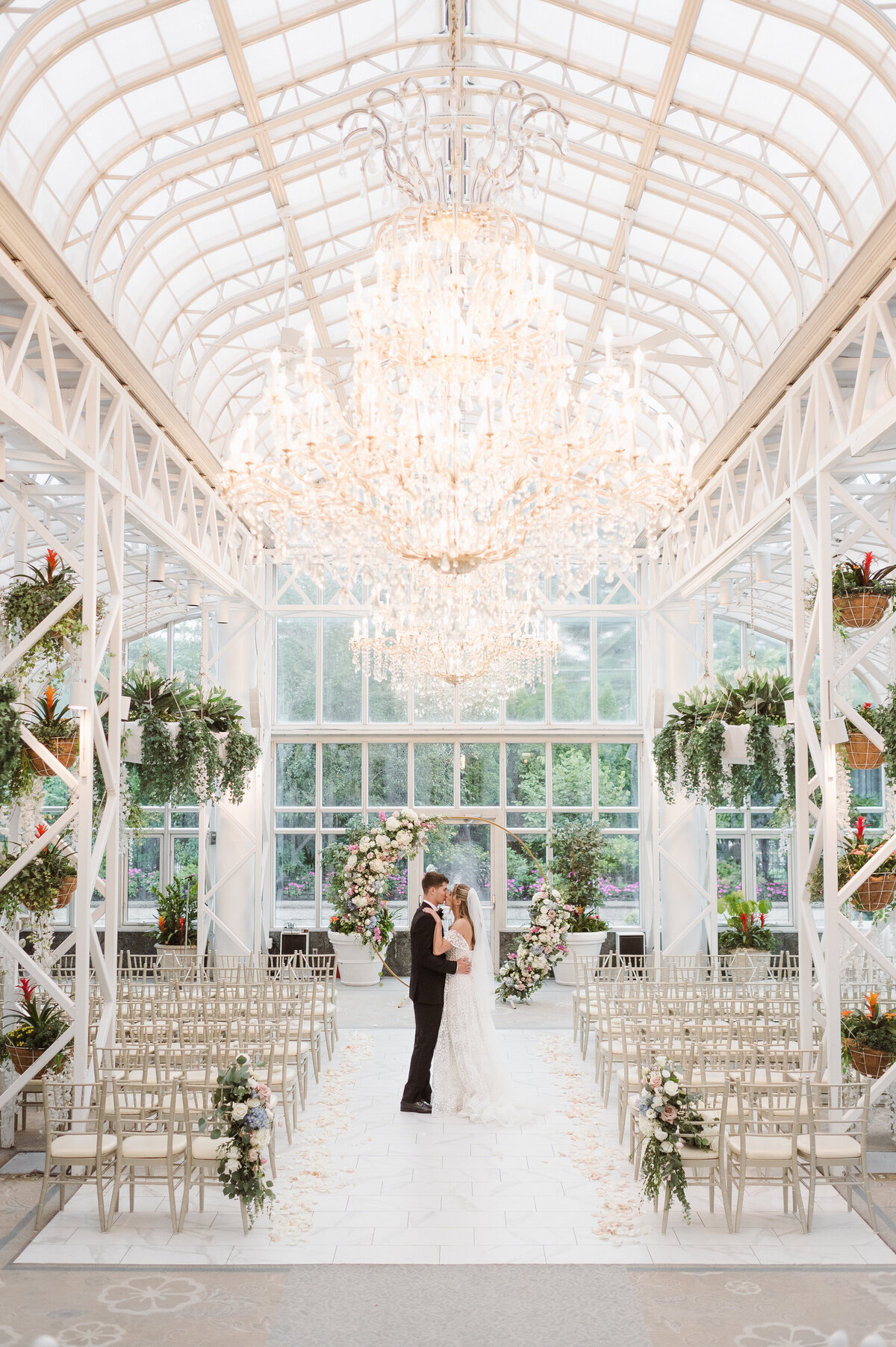 bride and groom portraits in the madison hotel conservatory venue nj