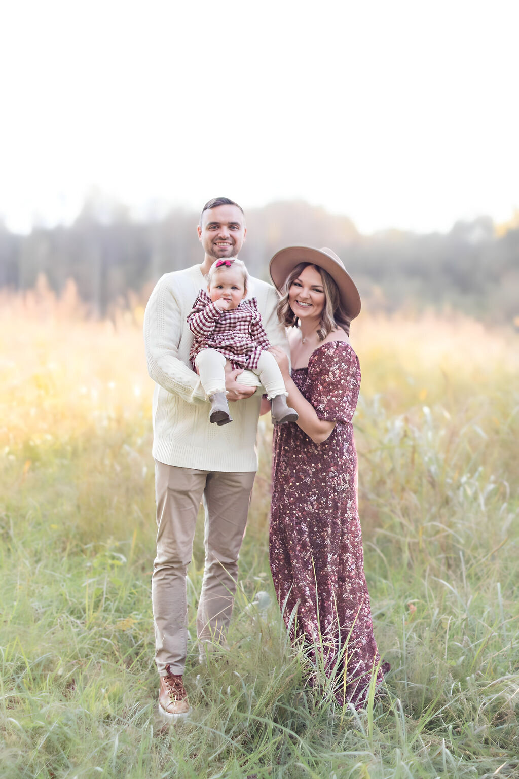 Family of three at Jetton Park in golden light