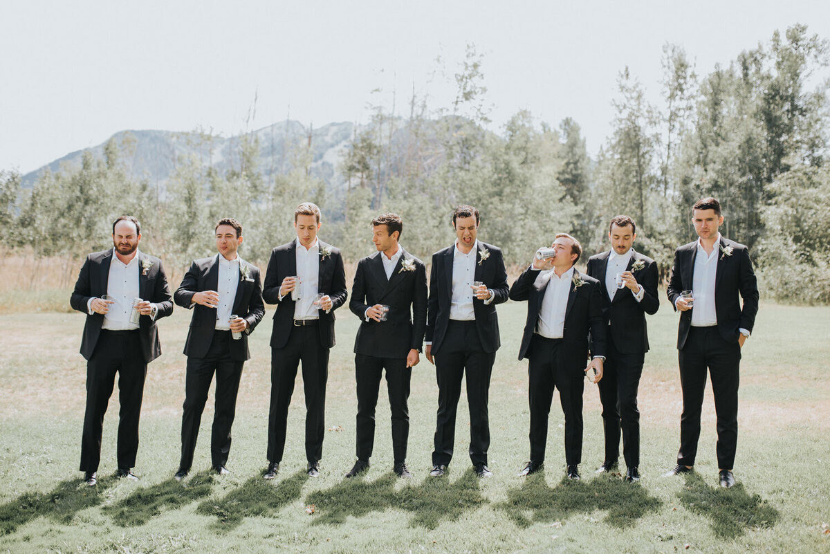 Groom and groomsmen with mountains in the background