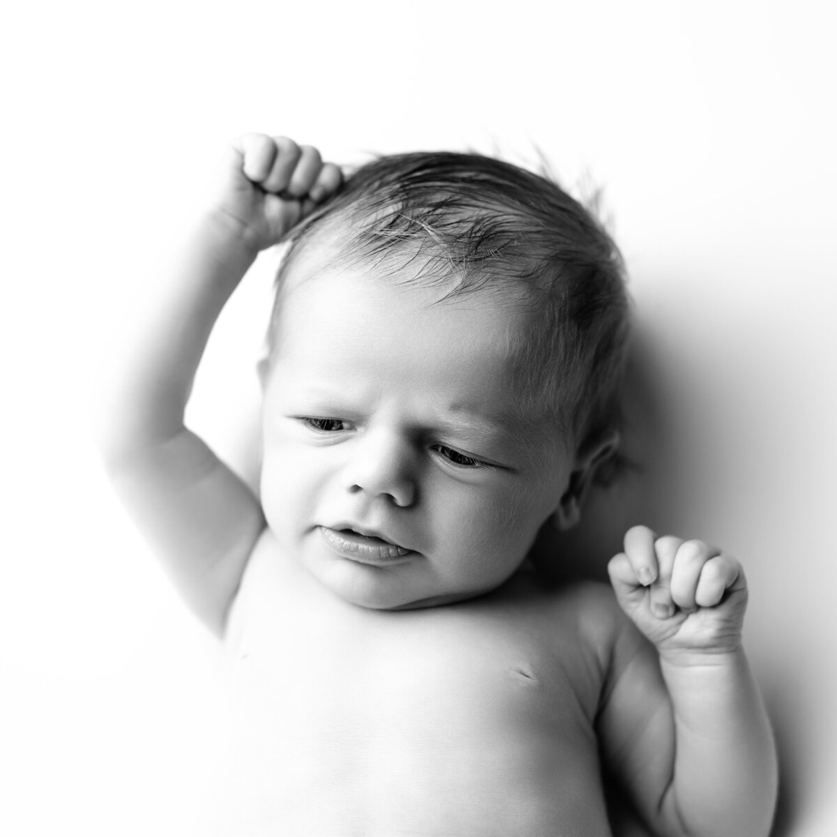Timeless black and white newborn expression—capturing personality in the tiniest of details.