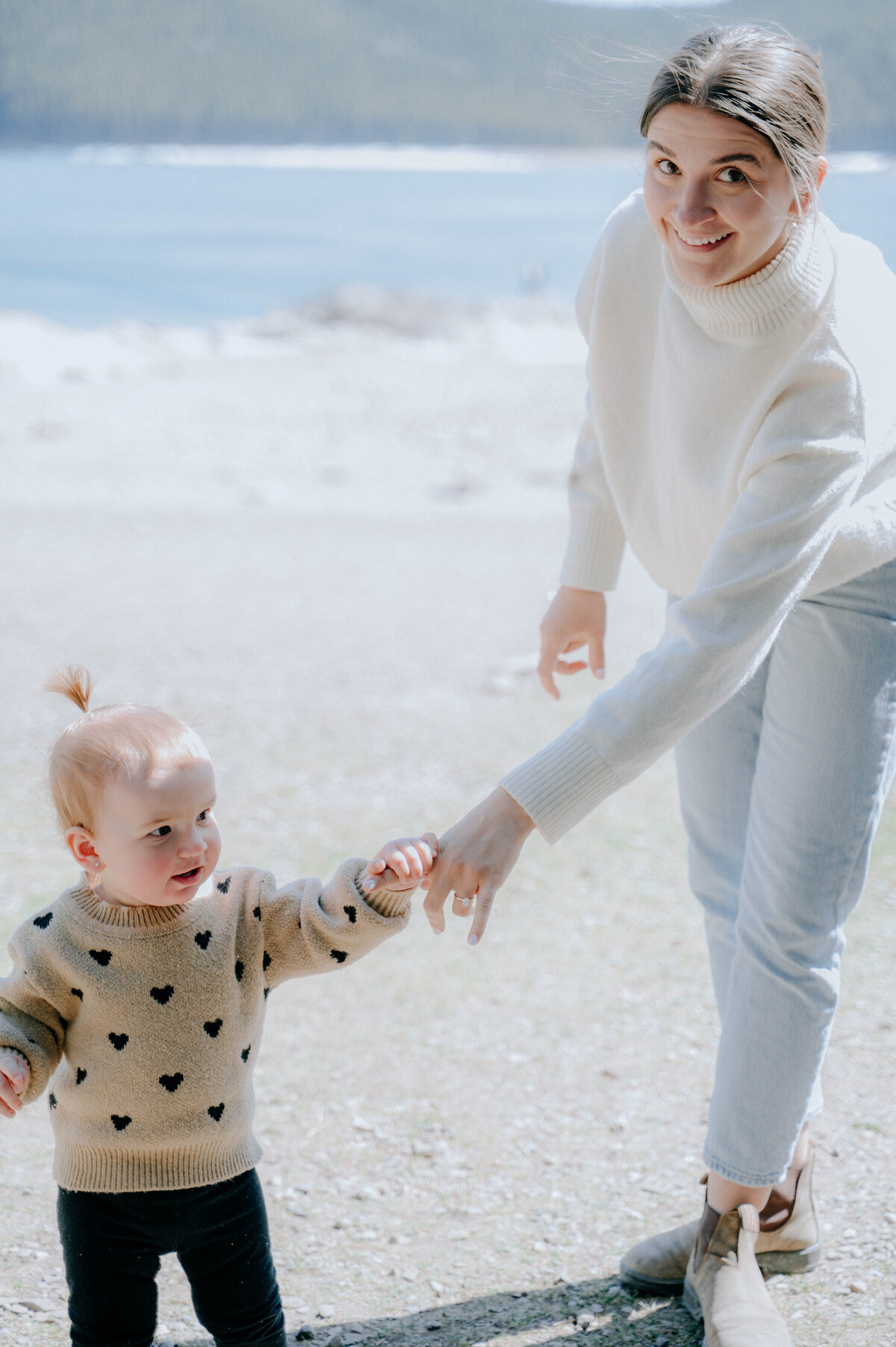 Adventurous toddler exploring mountain landscape during family shoot in Banff.
