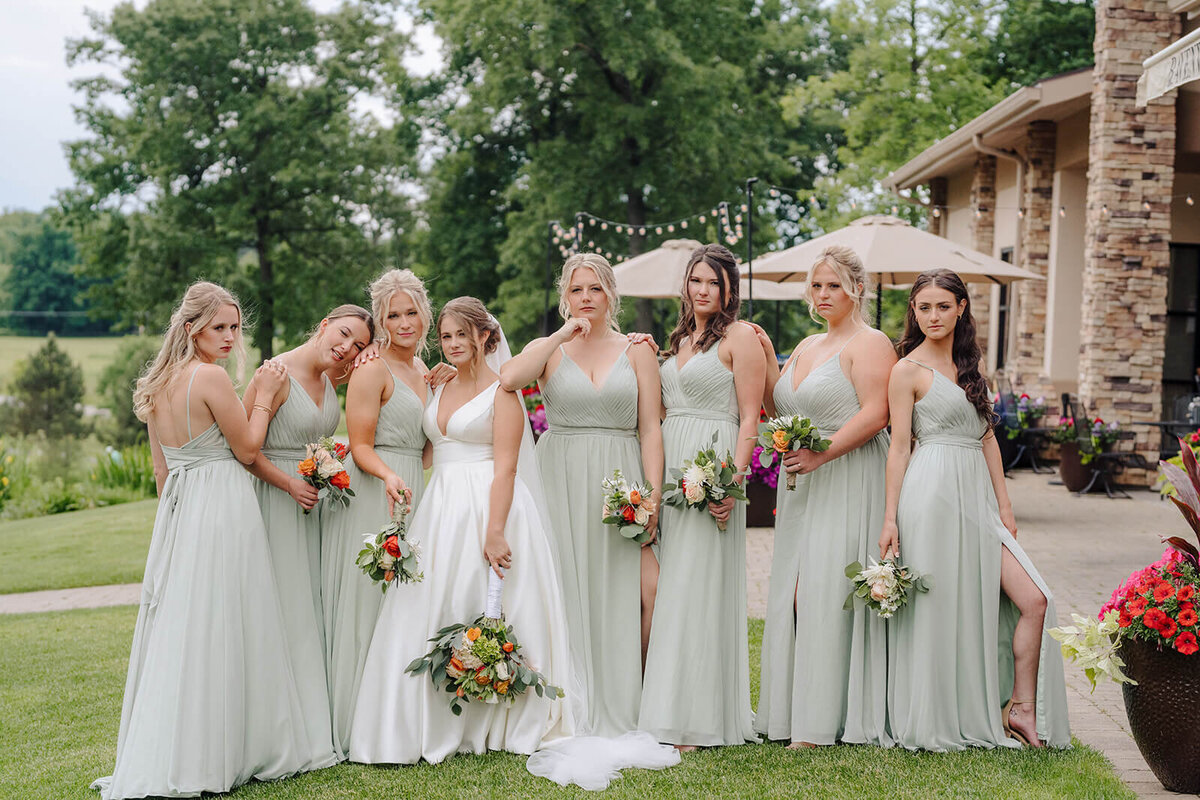 Bride with bridesmaids wearing plae green dreesses at Oswego wedding, NY