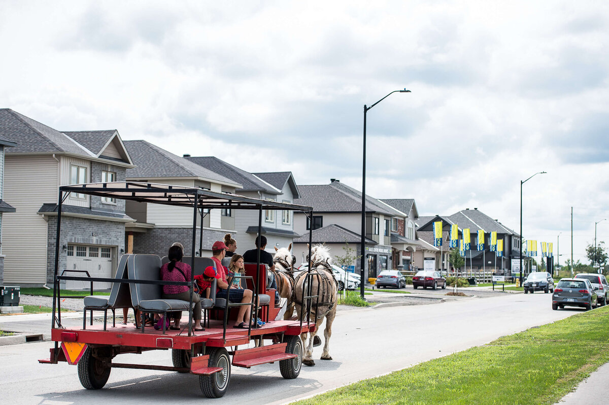 Ottawa event photography showing a horse-drawn carriage giving children a ride during a corporate children's event.  Captured by JEMMAN Photography COMMERCIAL