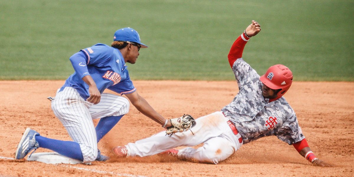 University of South Alabama baseball player slides into second base vs Sunbelt rival UTA.