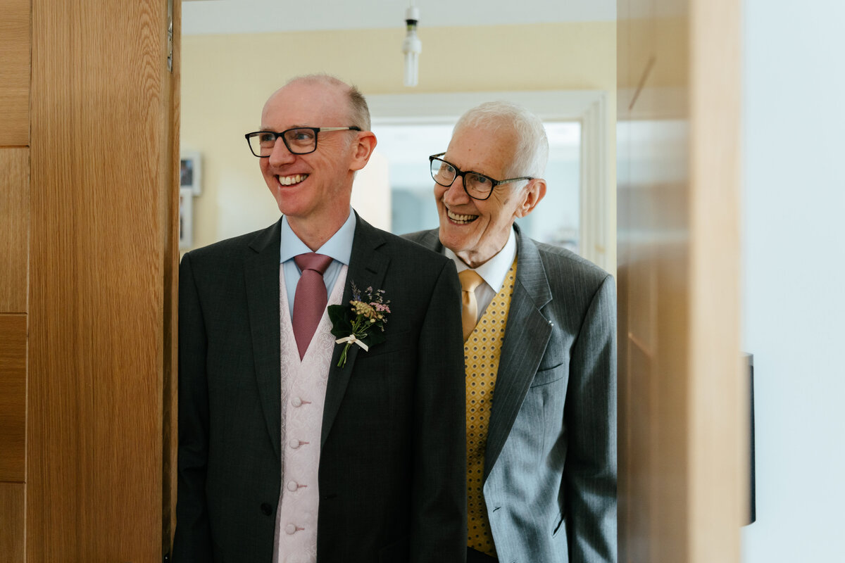 Father-and-Gradfather-Looking-At-Bride