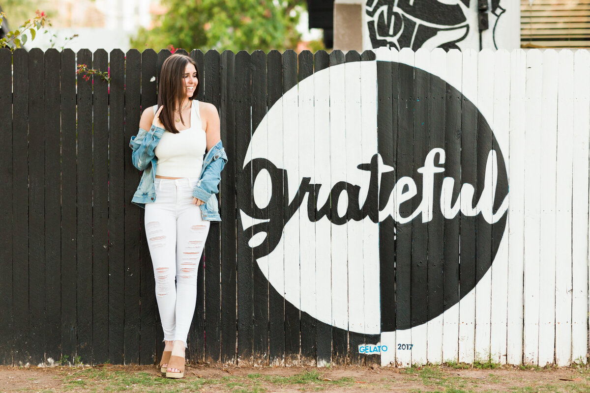 high school senior girl poses for senior photography session