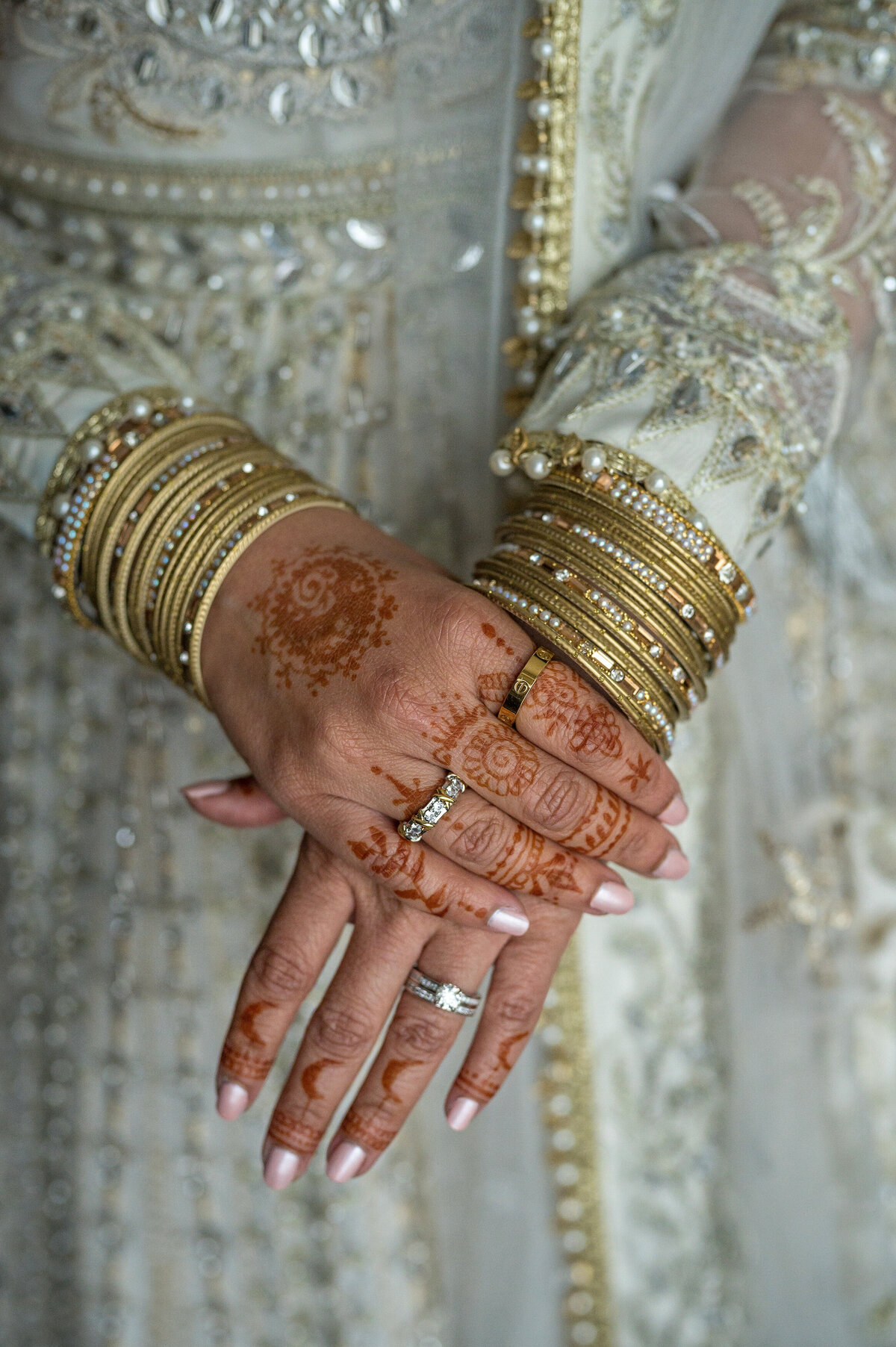Brides hands with jewelry.