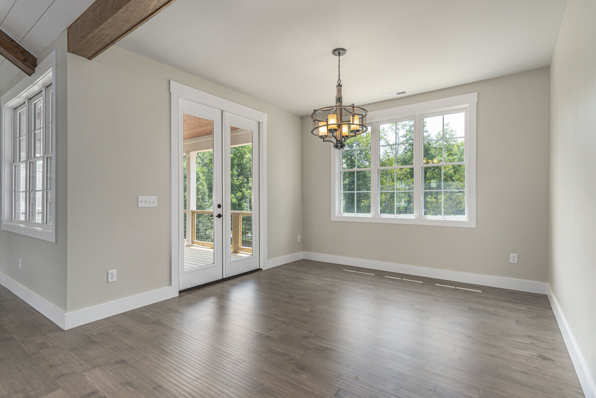 A large dining room with big windows
