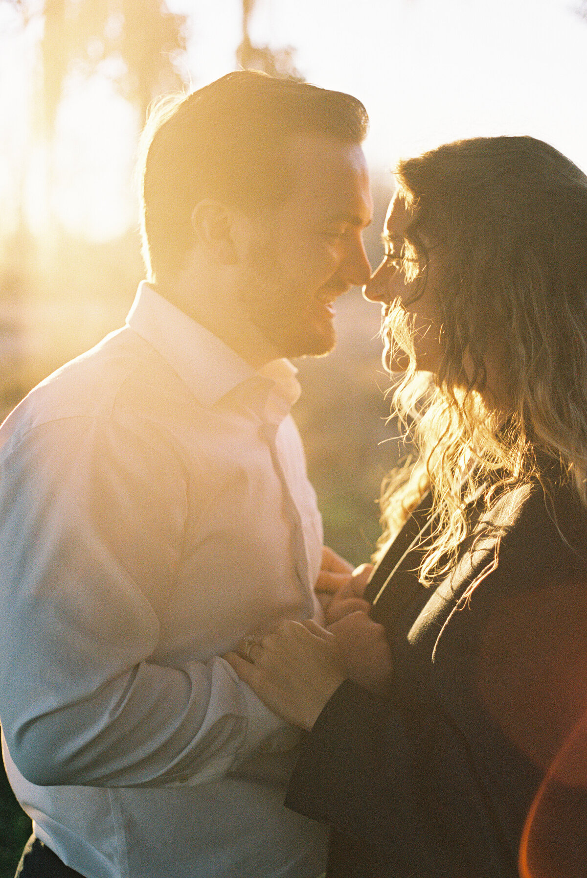 Couple in love on film photography with gorgeous sunset