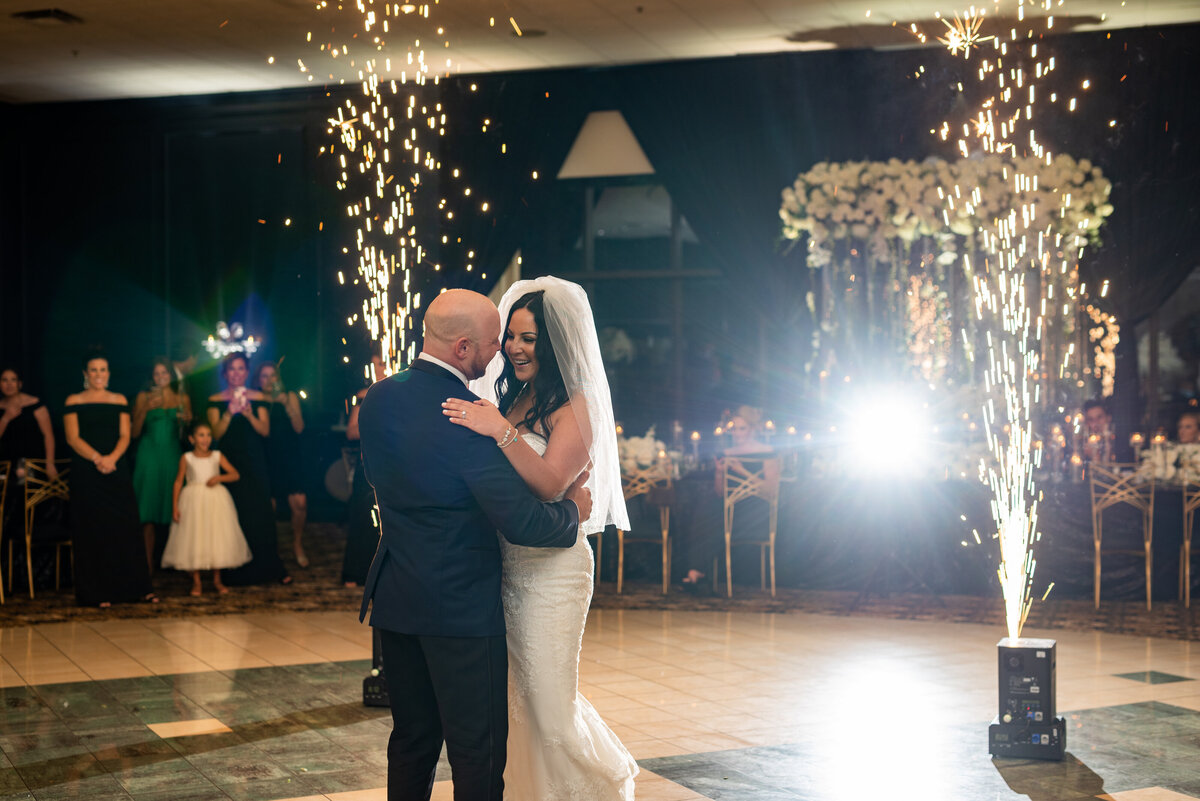 Bride and Groom share first dance with cold spark fireworks during their first dance.