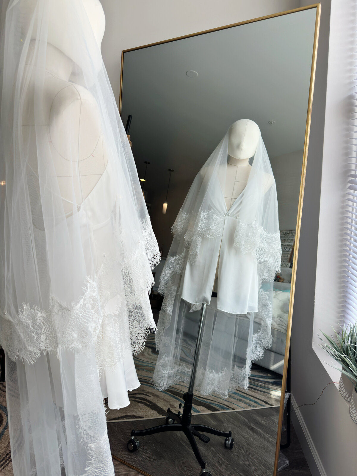 Handmade lace-edge blusher veil flowing softly in breeze
