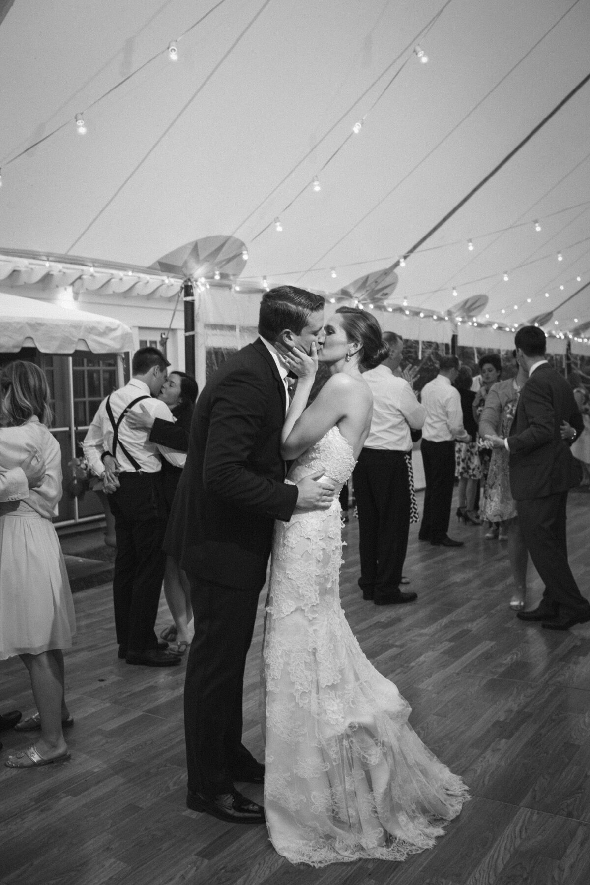 Bride and Groom kiss on the dancefloor during wedding reception.