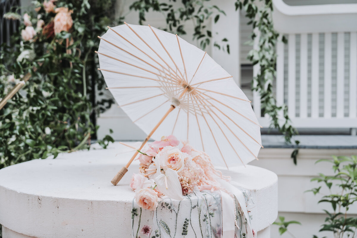 wedding bouquet, umbrella and veil set up for details