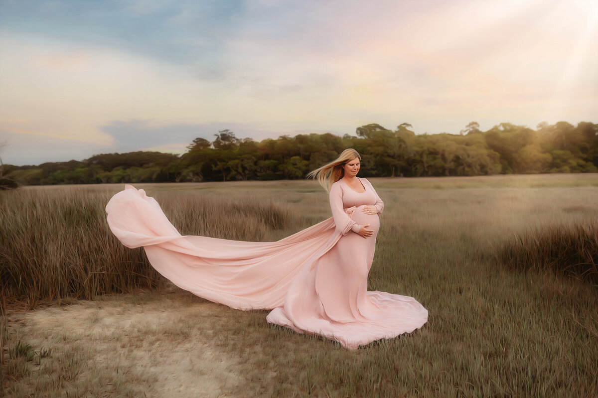 Pregnant woman poses for Maternity Photos in Charleston, SC.