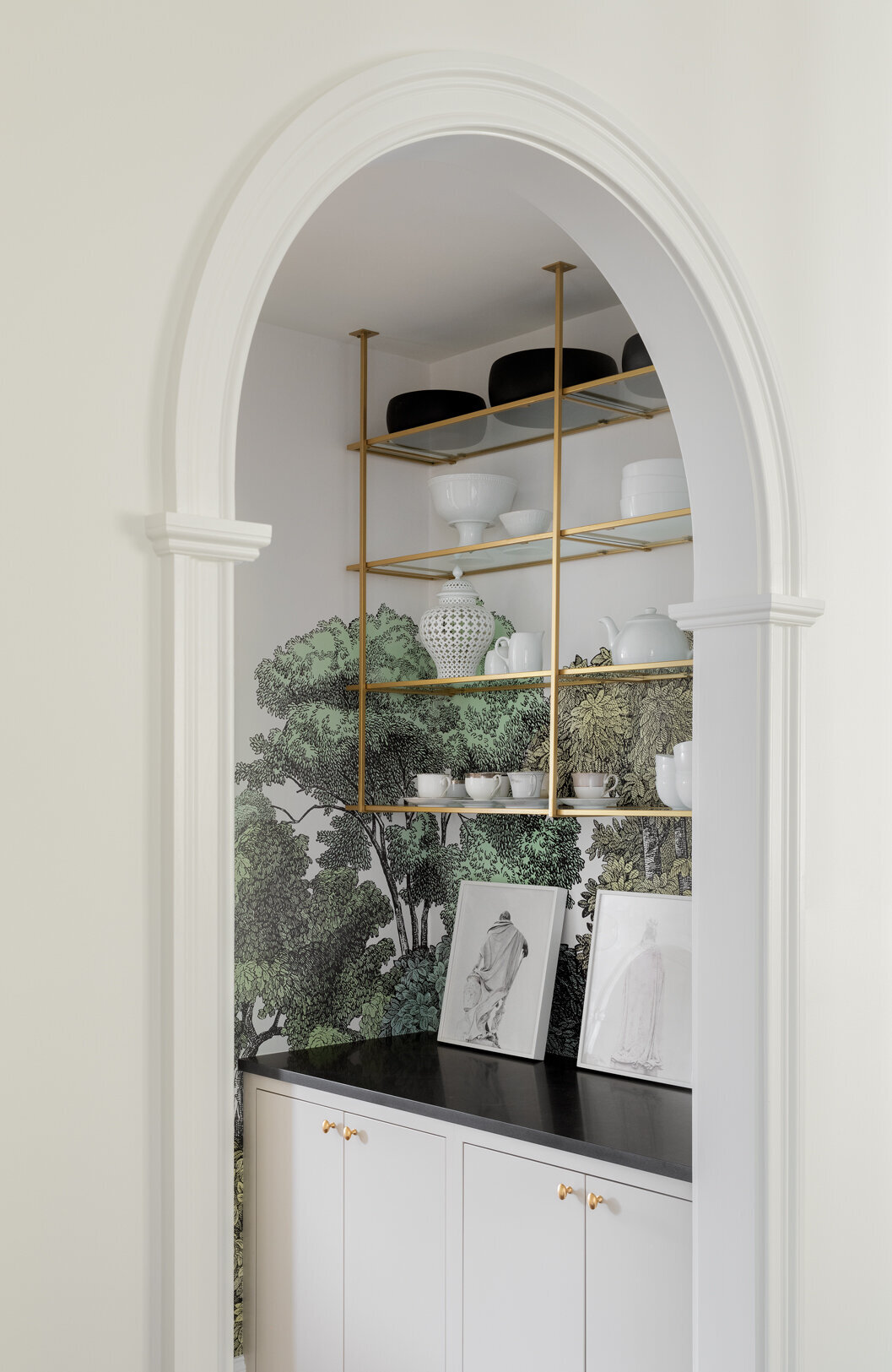 kitchen archway with gold open shelves
