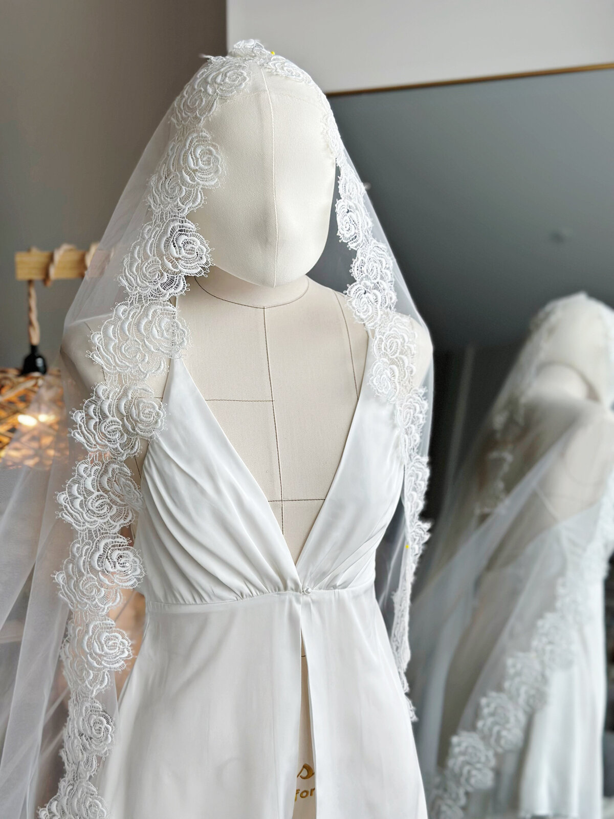 Romantic lace mantilla veil styled for classic wedding portraits