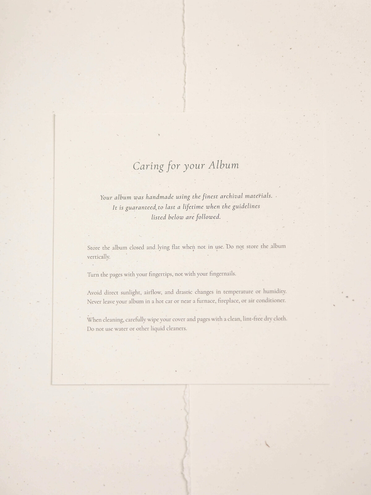 A printed sheet titled Caring for your Album on a textured paper background. It provides guidelines for proper album storage, handling, and cleaning to ensure its longevity.