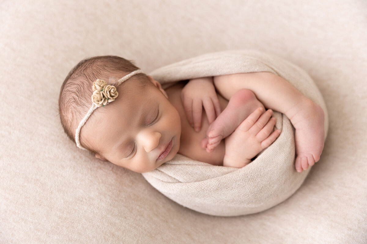 Baby girl in neutrals, photographed by Susan Hennessey is a South Jersey newborn photographer with a studio in Moorestown, NJ