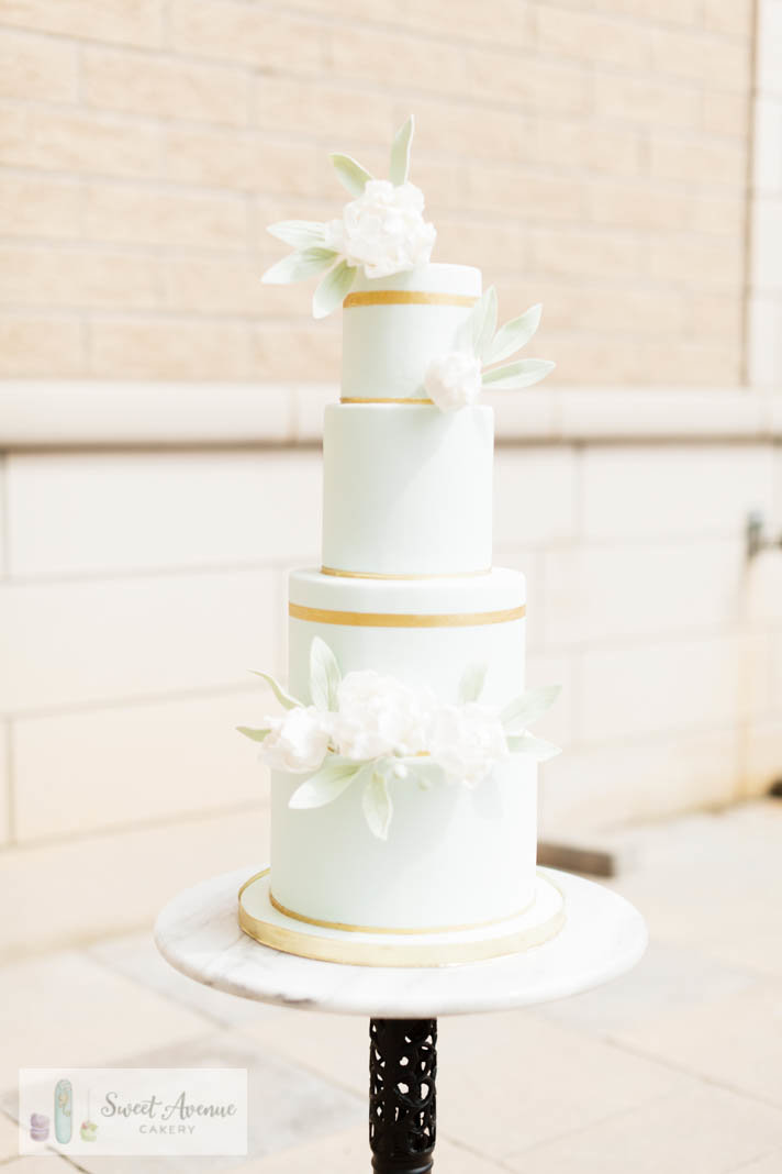 modern french blue wedding cake with gold accents and white flowers, wedding cakes Hamilton