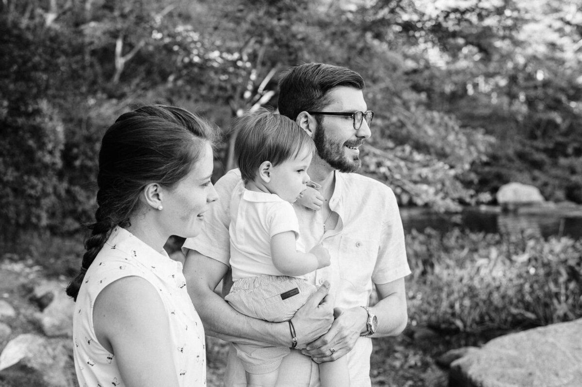 Family holding toddler during family portrait session.