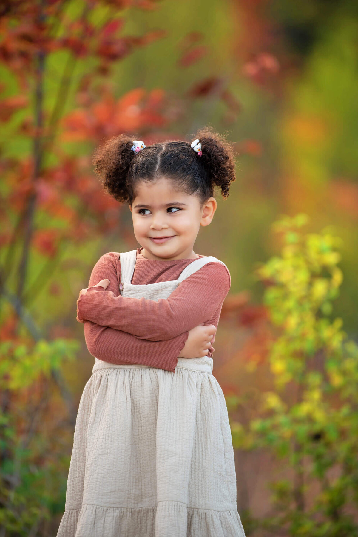 little girl with her arms crossed for her fall family photos