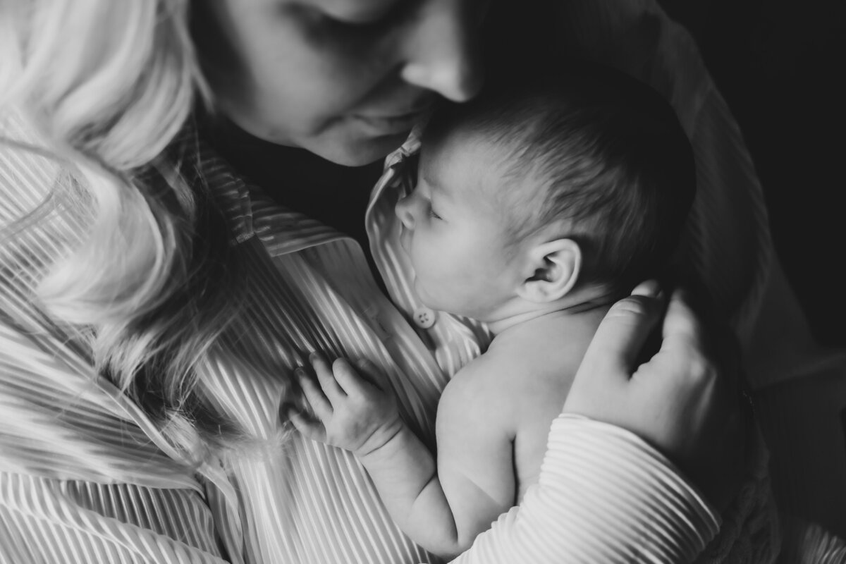mum hugging newborn baby