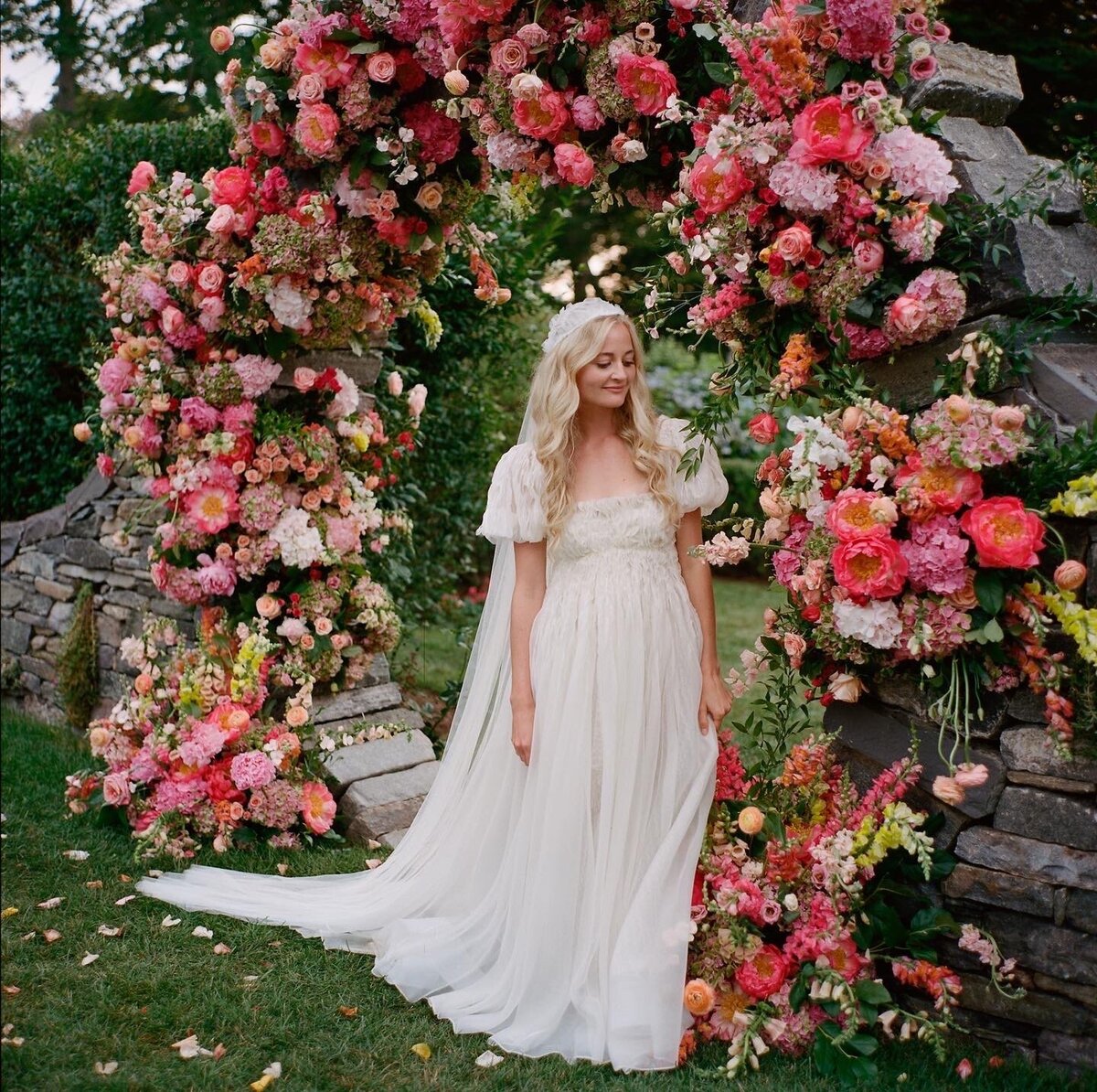 erica-renee-beauty-hair-and-makeup-duo-traveling-team-Newport-Harling-Ross-getting-ready-private-home-wedding-nyc-cool-bride-fashion-stylish-duo-long-blond-curls-cap-veil-cap-sleeves-natural-makeup-pre-raphaelites-lush-flowers