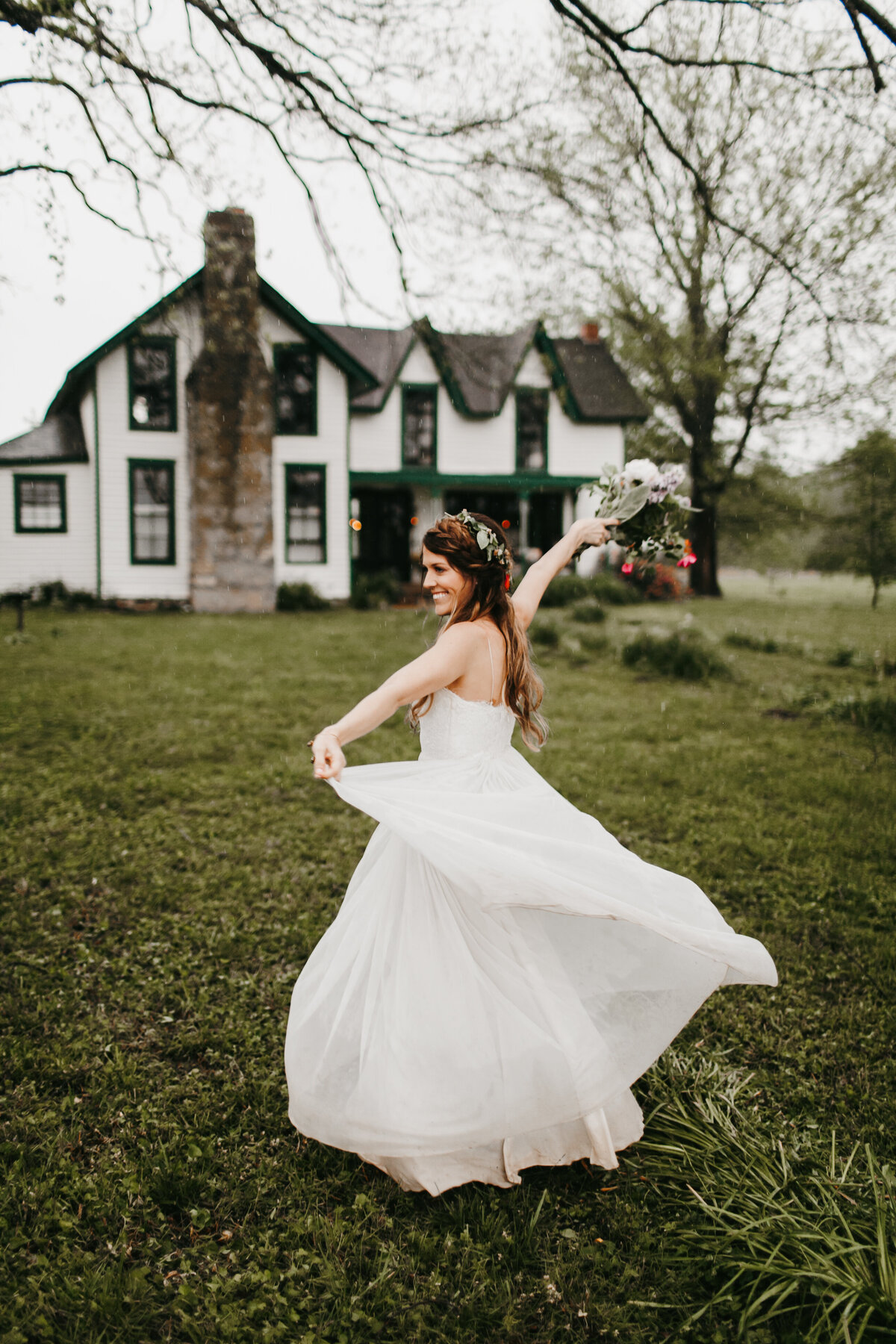 bride dancing in her dress outside