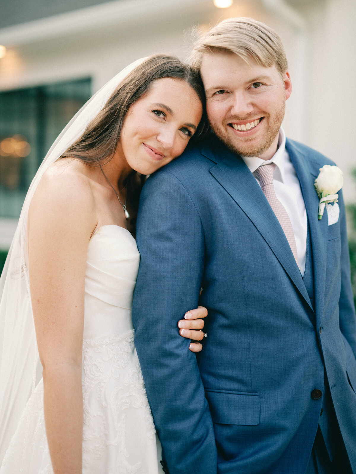 bride and groom cuddling at the peach orchard wedding venue