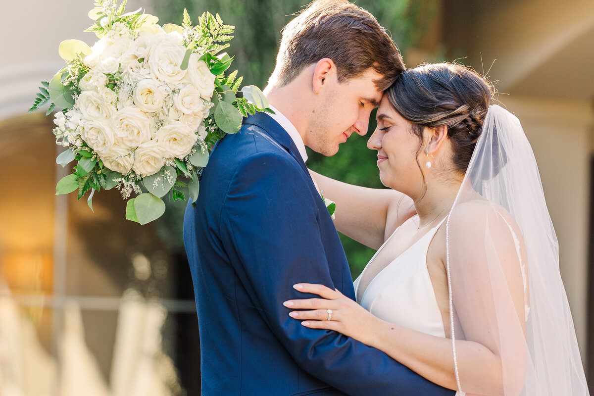EBride-and-groom-share-a-sweet-moment-outside-after-their-wedding
