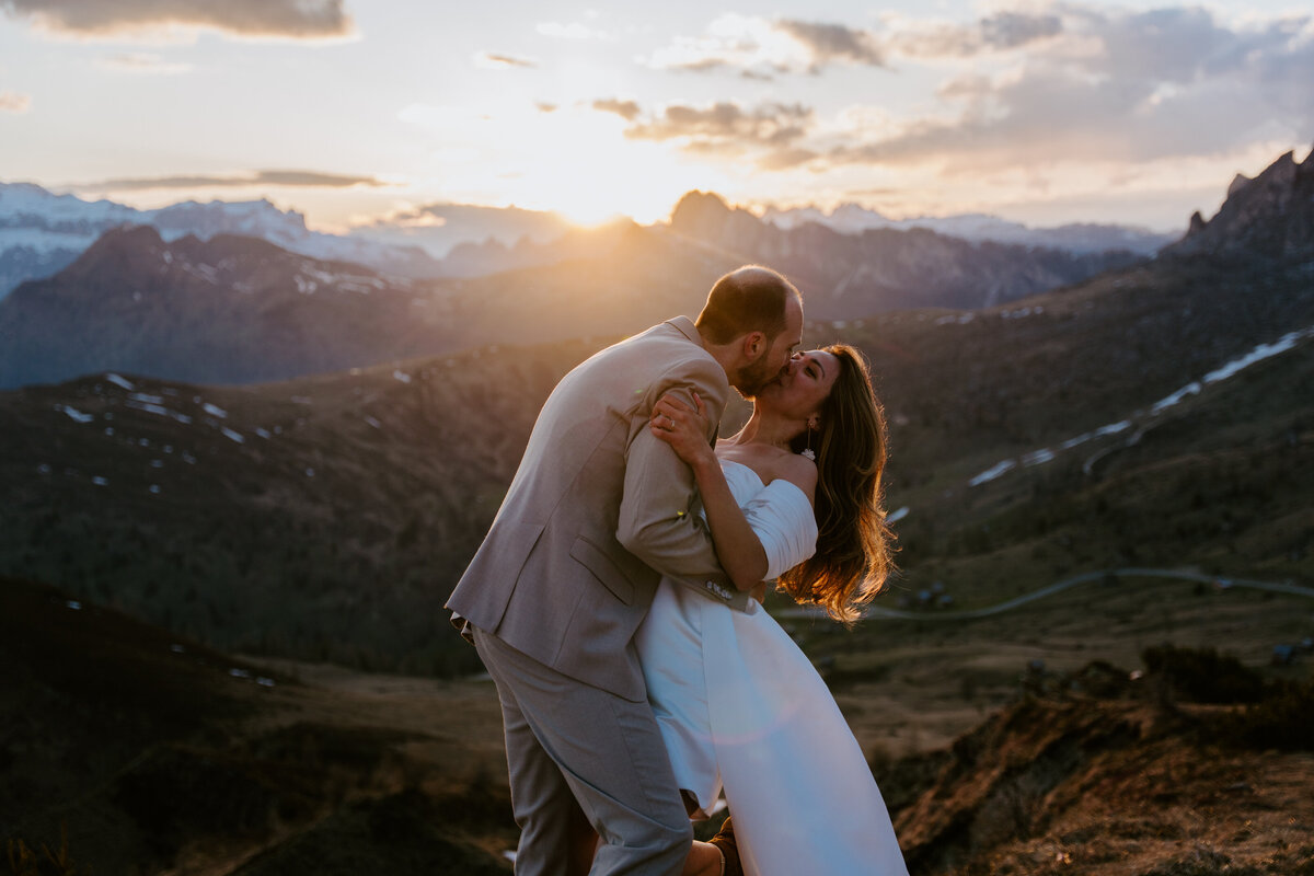romantic couple kissing during twilight elopement in Dolomites