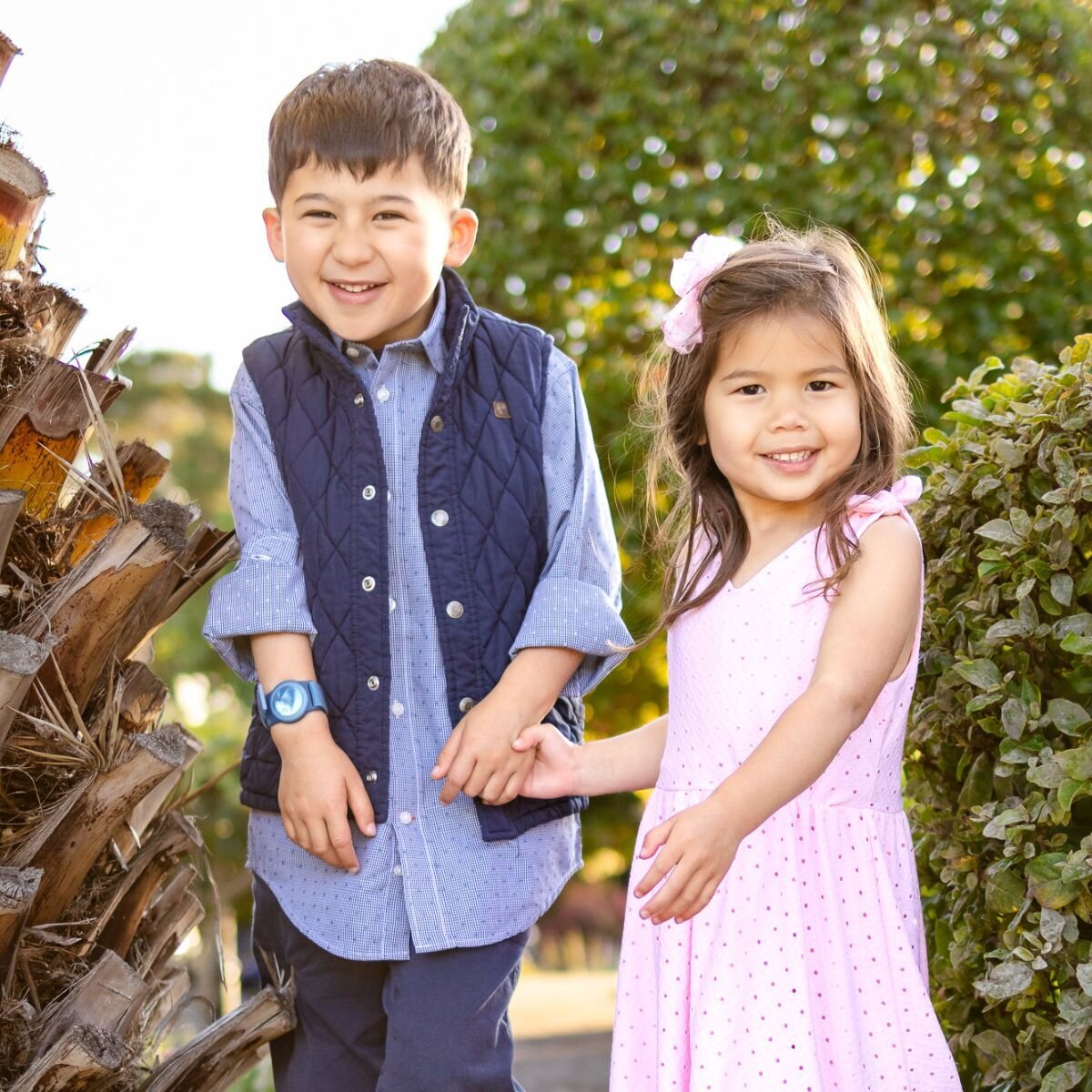 Brother and sister holding hands and smiling during Bay Area school photography lifestyle session – Ellobelle Photography