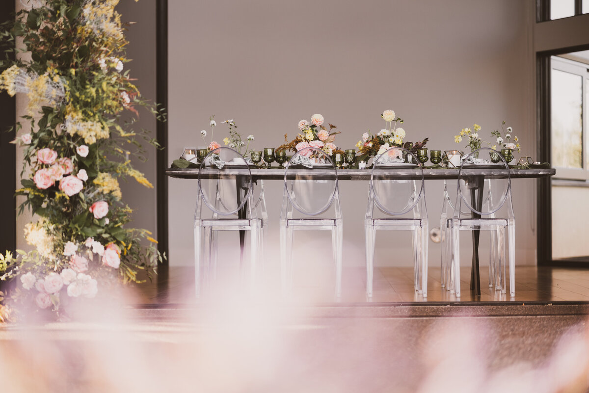 Ghost chair and farm table wedding reception tablescape