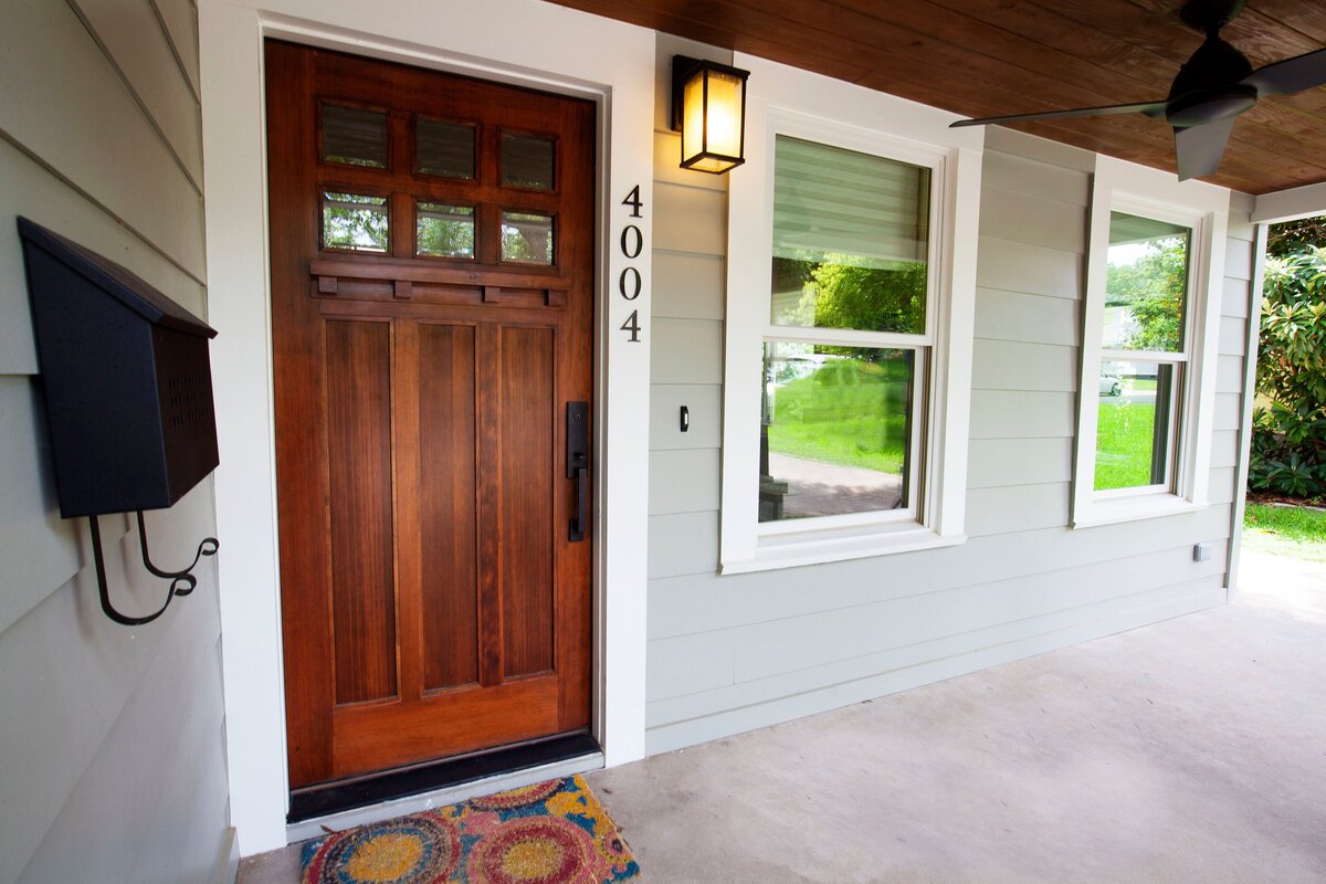 classic wooden door on large front porch